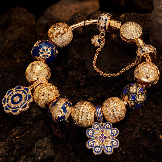 gona- Sterling Silver Ice and Blue Charms Bracelet Set With Enamel In 14K Gold Plated (Includes bracelet and all charms shown)