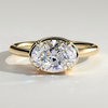 2ct Oval Lab-Grown Diamond East-West Claw Solitaire with Bezel Frame Engagement Ring in Solid 14K Yellow Gold (Includes IGI Certification from International Gemological Institute)