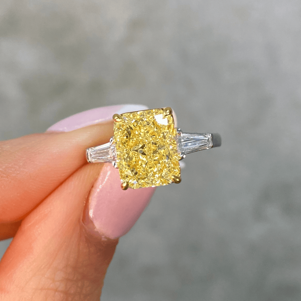 Golden Majesty - 3.0 ct Radiant Cut Lab-Grown Fancy Vivid Yellow Diamond Three-Stone Ring with 0.48CT.TW Tapered Baguette Diamond Side Stones In Tarnish-resistant Silver (Includes IGI Certification from International Gemological Institute)