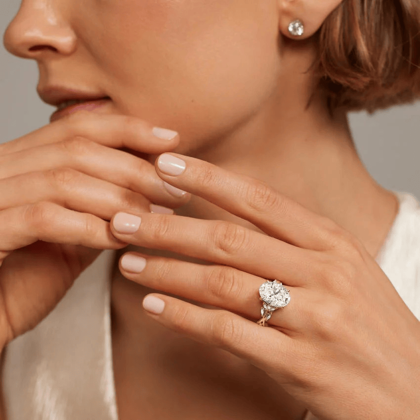 Secret Garden · 2.0 CT Oval Lab-Grown Diamond Ring with Vine Leaf Accent Band & Claw Setting in Solid 14K Yellow Gold · (Includes IGI Certification from International Gemological Institute)