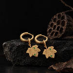 Solid 925 Sterling Silver Hoop Earrings With Maple Leaf Charms And Emerald Green Accents With 14K Gold Plating
