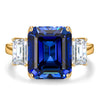 Emerald-Cut 5.5CT Royal Blue Lab-Grown Sapphire Engagement Ring – Three Stone Classic Design with Moissanite Side Stones, 14K Yellow Gold Plated on Tarnish-Resistant Silver（Includes GRC Certification from Gemstone Research Center）