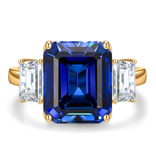 gona- Emerald-Cut 5.5CT Royal Blue Lab-Grown Sapphire Engagement Ring – Three Stone Classic Design with Moissanite Side Stones, 14K Yellow Gold Plated on Tarnish-Resistant Silver（Includes GRC Certification from Gemstone Research Center）