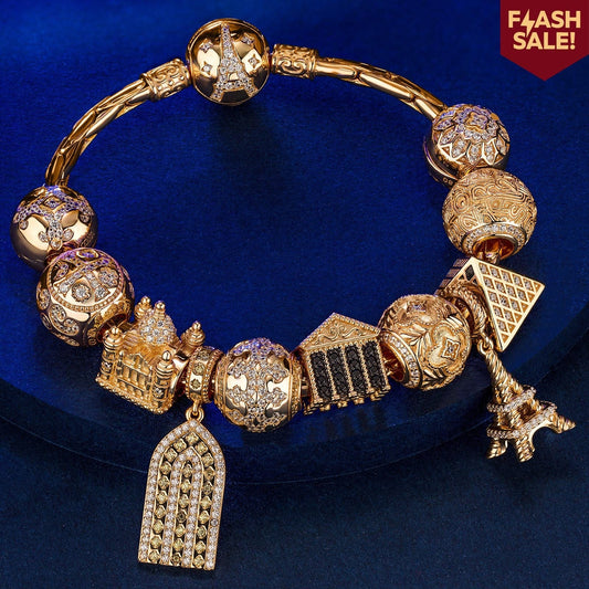 gona- Sterling Silver Golden Paris Charms Bracelet Set In 14K Gold Plated (Includes bracelet and all charms shown)
