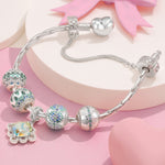 Sterling Silver Twirling in Time Charms Bracelet Set With Enamel In White Gold Plated (Includes bracelet and all charms shown)