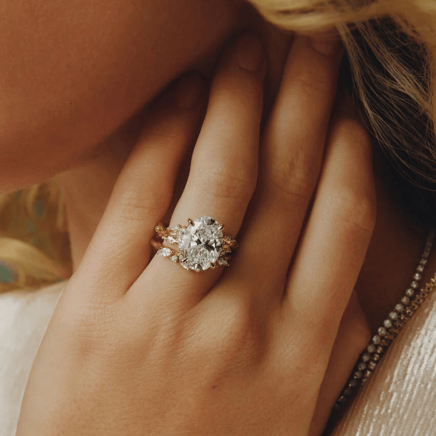 Secret Garden · 2.0 CT Oval Lab-Grown Diamond Ring with Vine Leaf Accent Band & Claw Setting in Solid 14K Yellow Gold · (Includes IGI Certification from International Gemological Institute)