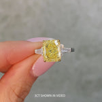 Golden Majesty - 3.0 ct Radiant Cut Lab-Grown Fancy Vivid Yellow Diamond Three-Stone Ring with 0.48CT.TW Tapered Baguette Diamond Side Stones In Tarnish-resistant Silver (Includes IGI Certification from International Gemological Institute)